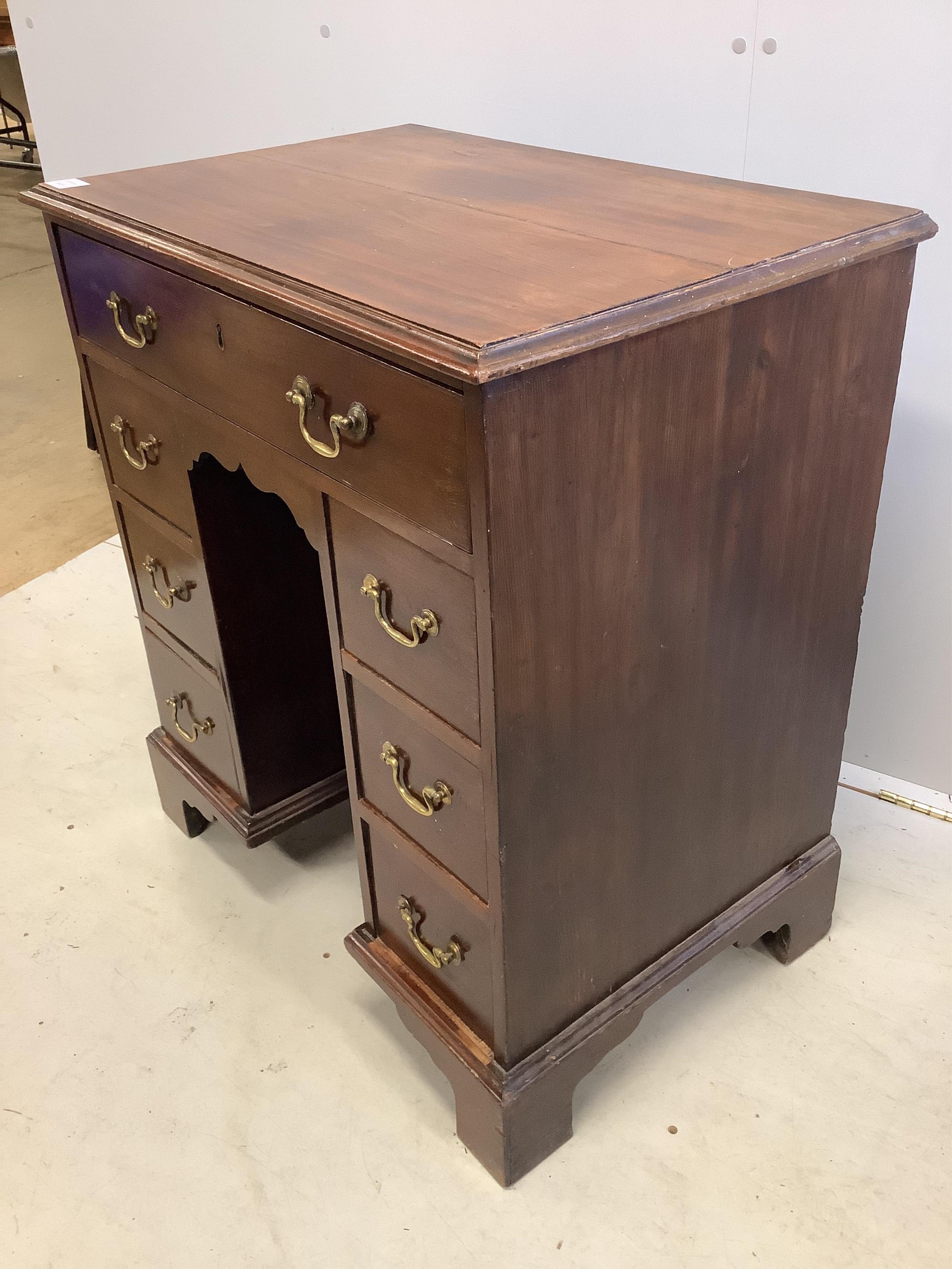 A George III mahogany kneehole desk, width 71cm, depth 48cm, height 80cm. Condition - fair to good